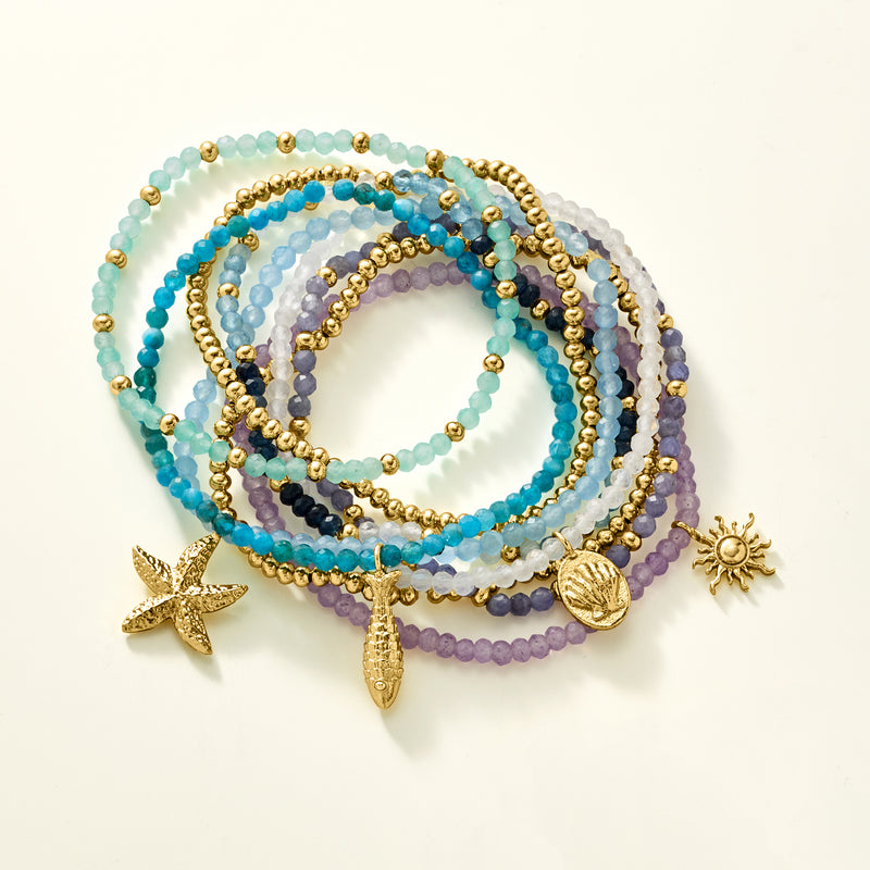 Multi-row sea life charm bead stretch bracelets with starfish, shell, and small sun accents
