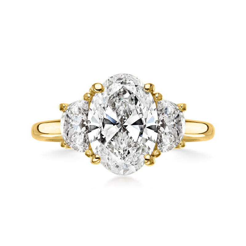 14kt yellow gold lab-grown diamond ring with oval center and side stones