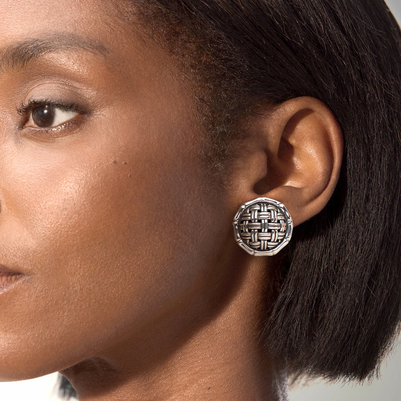Sterling silver round basketweave clip-on earrings worn on ear