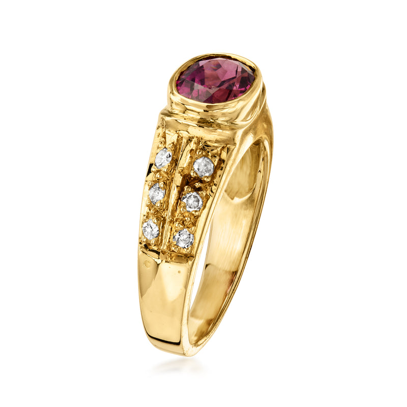 Oval rhodolite garnet ring in yellow gold with diamond-set bezel and shoulders