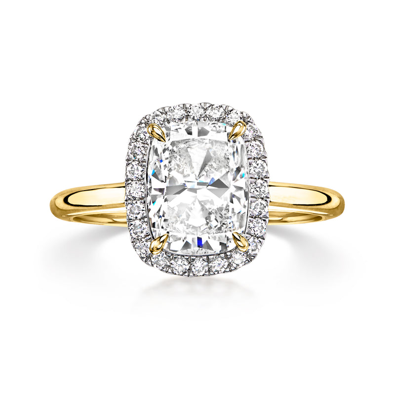 Yellow gold diamond ring with cushion-cut center and halo of round stones