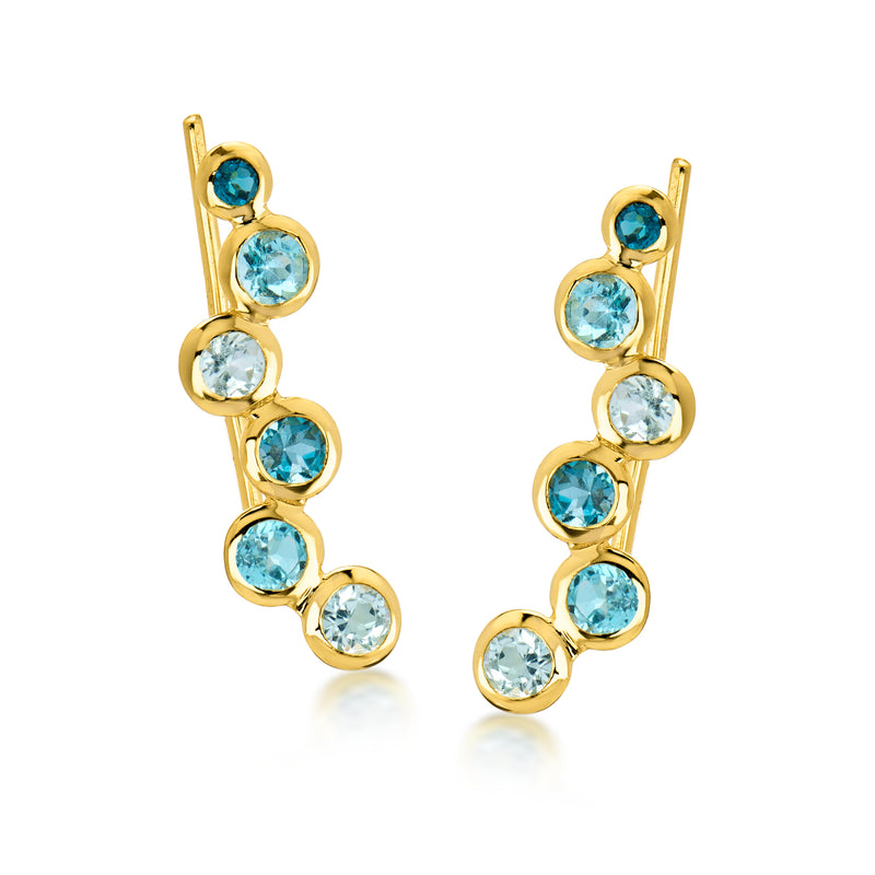Gold ear climber earrings with graduated round blue topaz in linked design