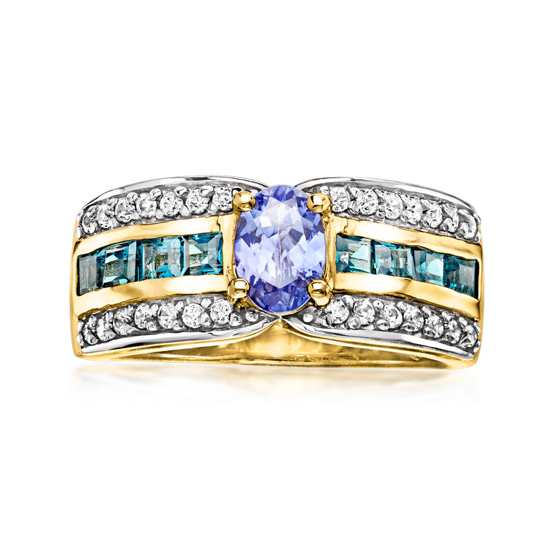 Gold over sterling ring with oval blue center stone and blue baguette side stones