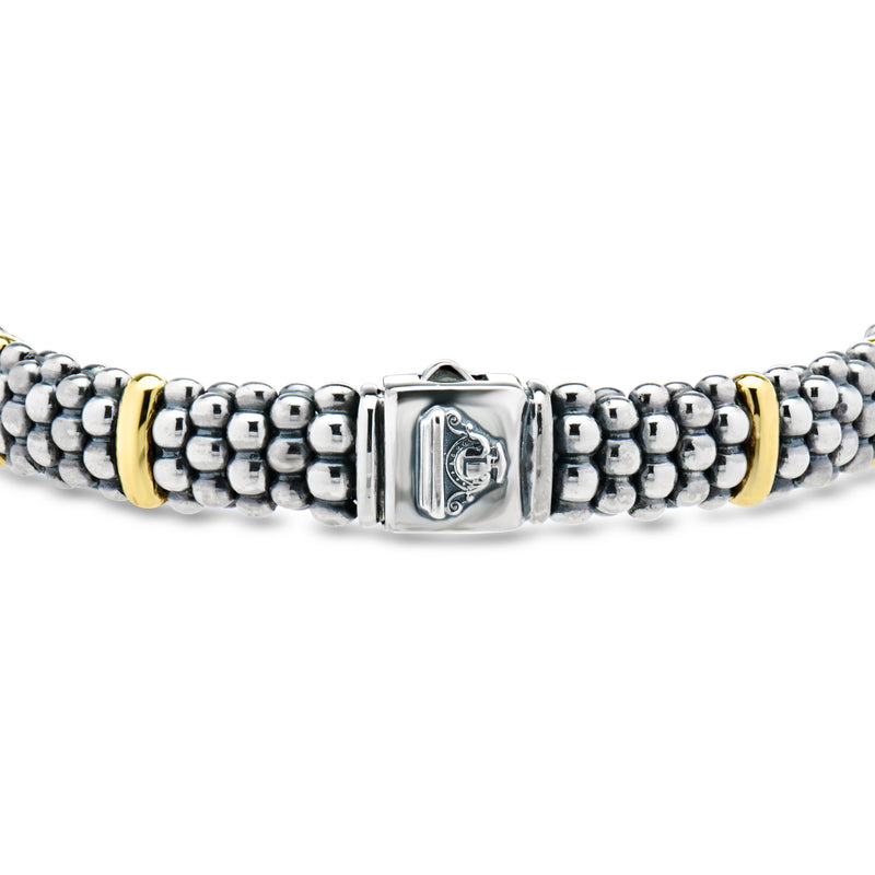 Sterling silver beaded bracelet with yellow gold side bars and shield-style centerpiece