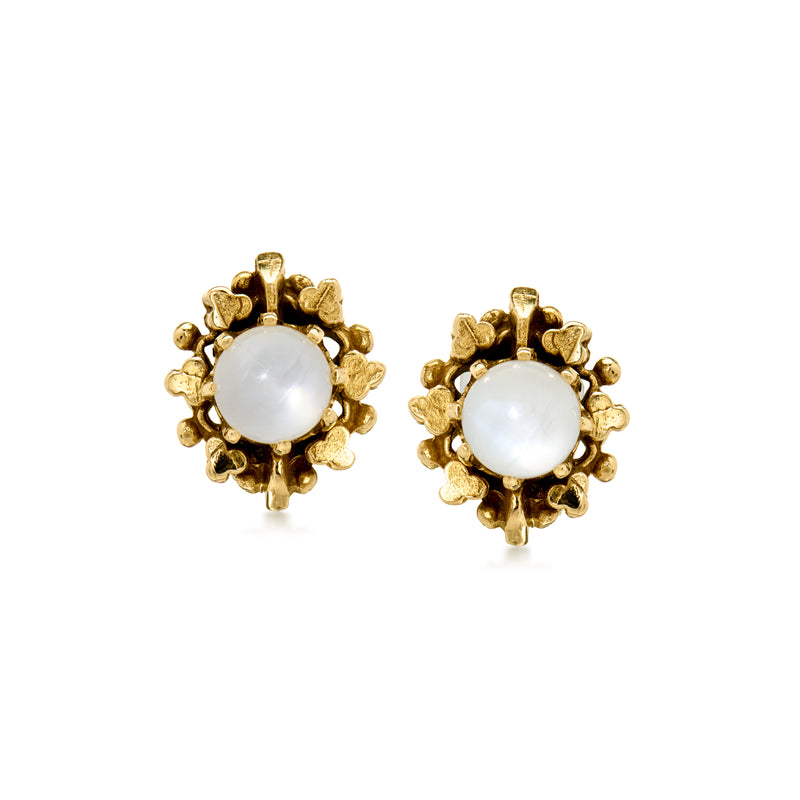 Gold stud earrings with white moonstone cabochon and scalloped textured bezel