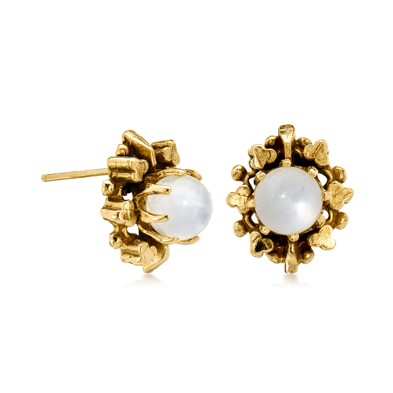 Gold post earrings with white moonstone cabochon in a textured, floral-like setting