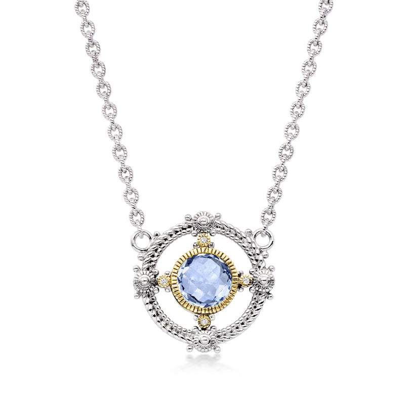 Sterling silver necklace with oval blue gemstone halo, diamond accents, yellow-gold bezel