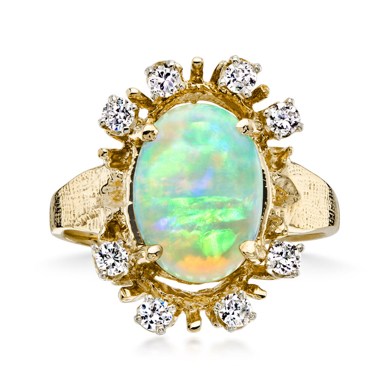 Oval opal center stone ring with round diamond halo in yellow gold setting