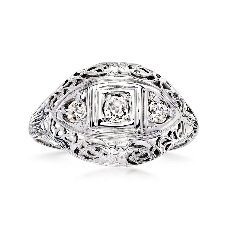 Vintage openwork diamond ring in 18kt white gold, oval bezel with four diamond accents