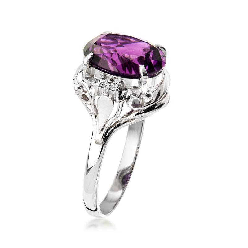 Platinum ring side view with oval amethyst center and diamond accents in prong setting