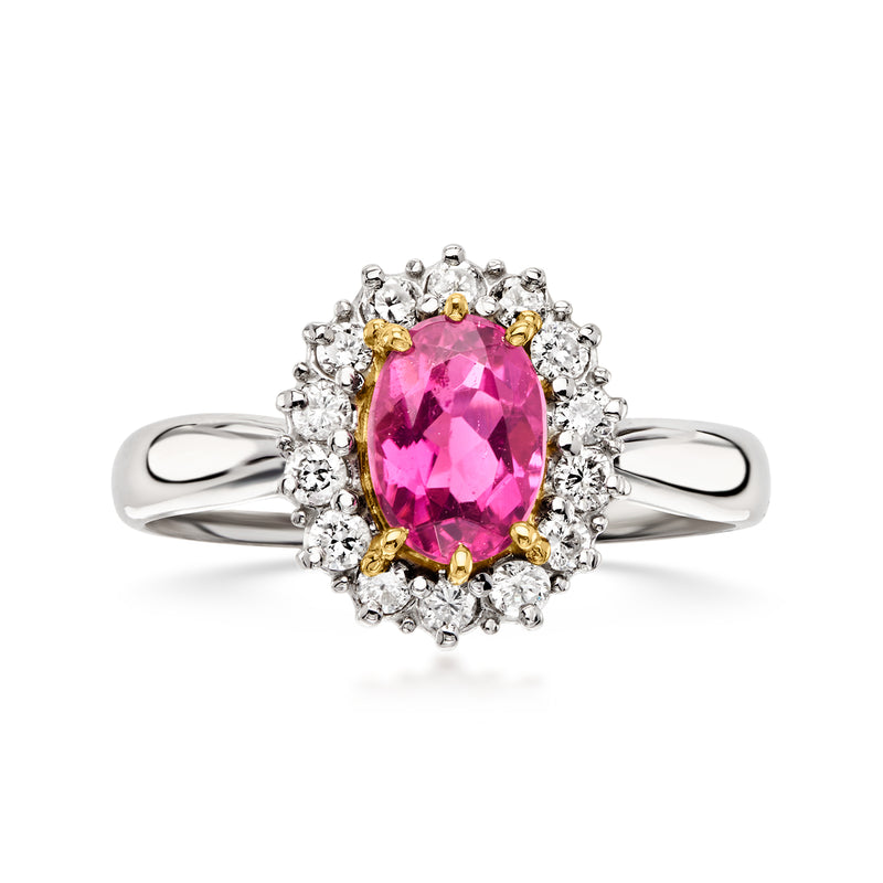 Vintage oval pink tourmaline ring with diamond halo and platinum split shank