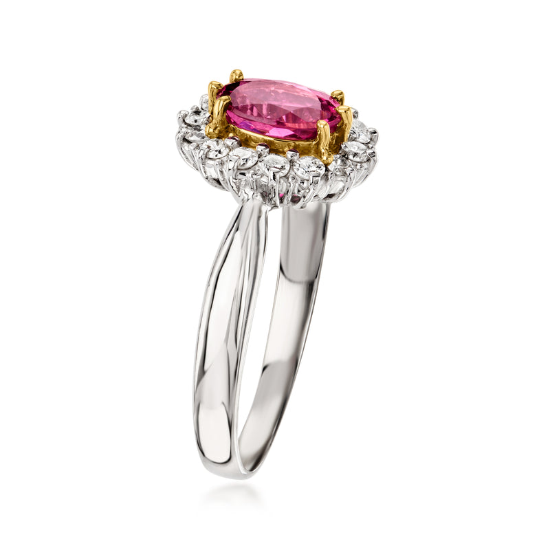 Platinum ring with oval pink tourmaline center in gold-toned prongs and diamond halo