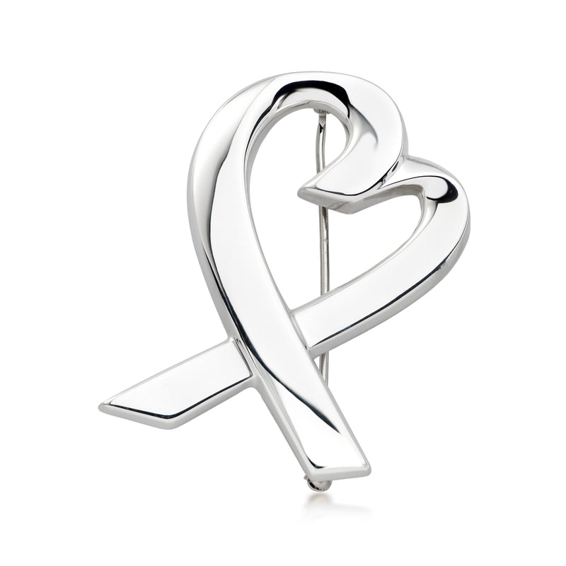 Sterling silver heart pin with ribbon-shaped loop and curved tail