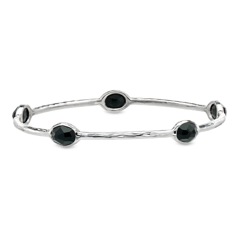 Sterling silver bangle bracelet with three black oval onyx stations