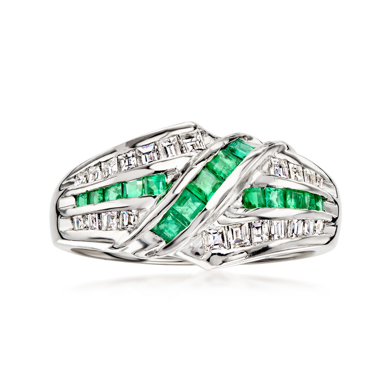 Platinum ring with green emerald inlays and baguette diamond accents