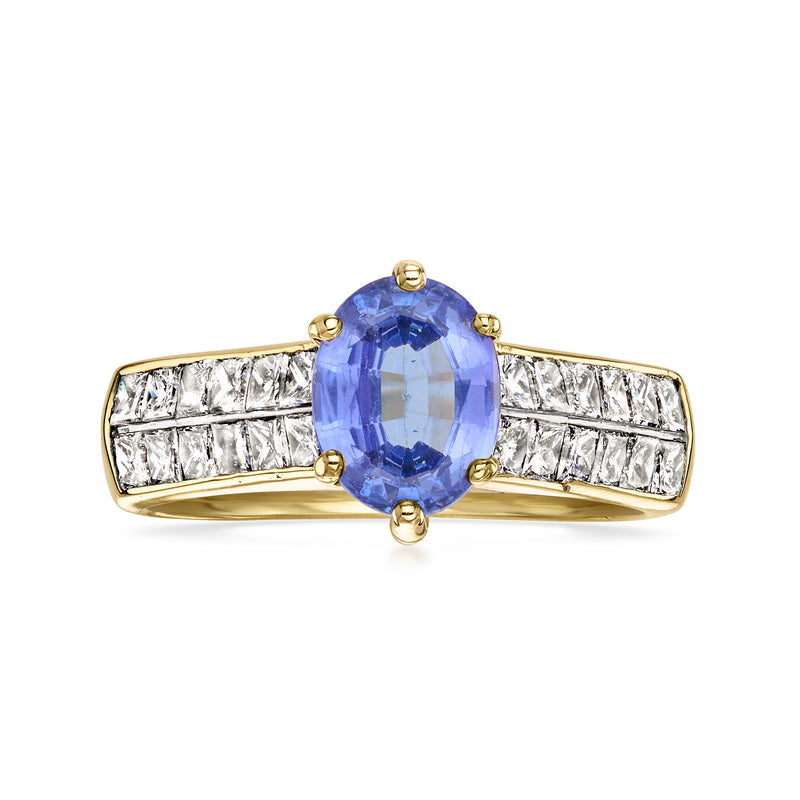 18k yellow gold ring with oval blue tanzanite and baguette diamonds on the band