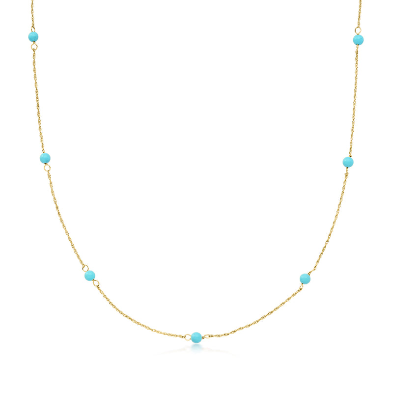 14kt yellow gold necklace with round turquoise beads on a fine chain.