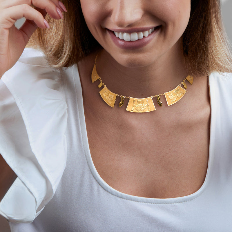 Vintage 18kt yellow gold Aztec-inspired necklace worn with engraved gold panels