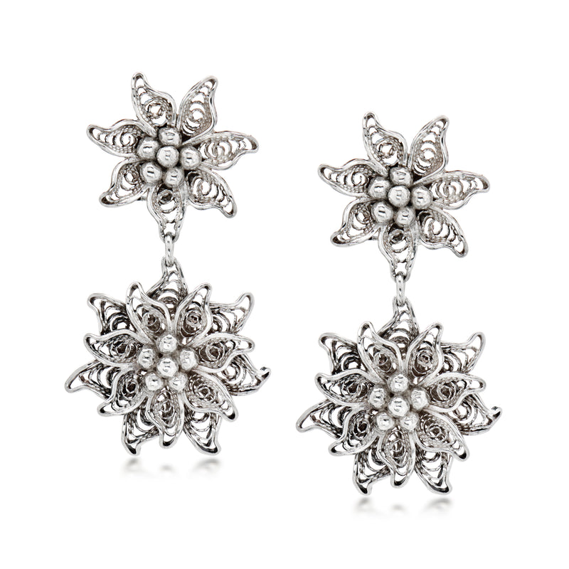 Sterling silver floral drop earrings with clip backs; ornate petals and bead accents