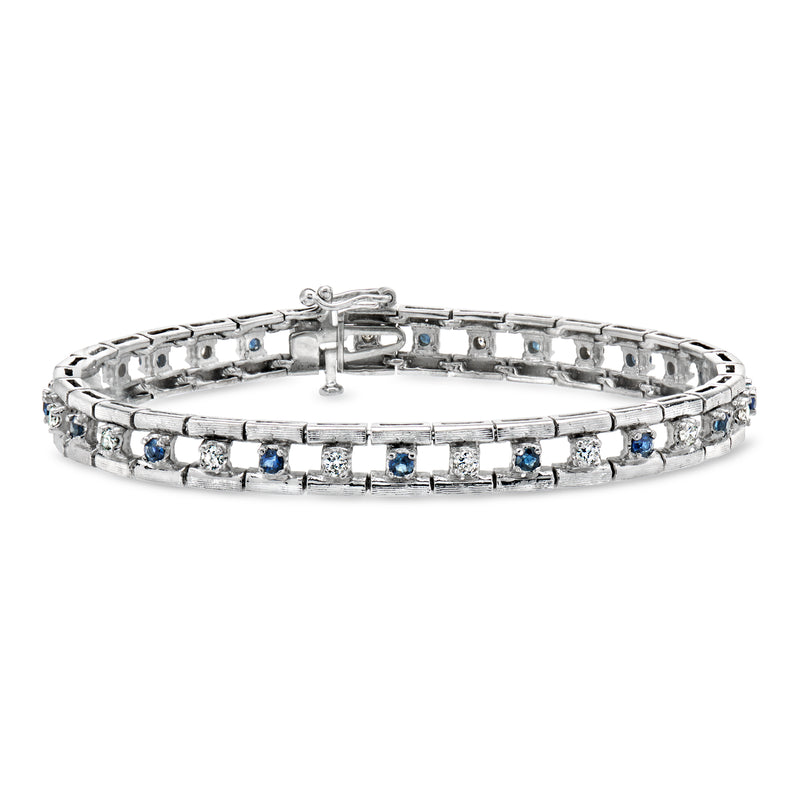 14kt white gold bracelet with blue sapphire and diamond channel settings