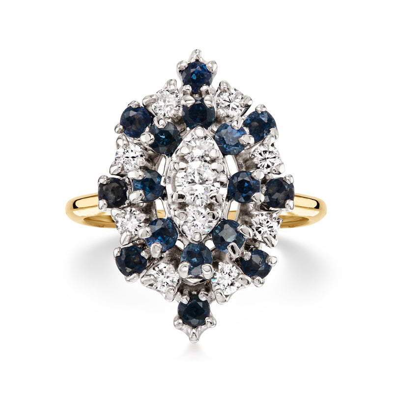 Two-tone gold cluster ring with blue sapphire halo and diamond center