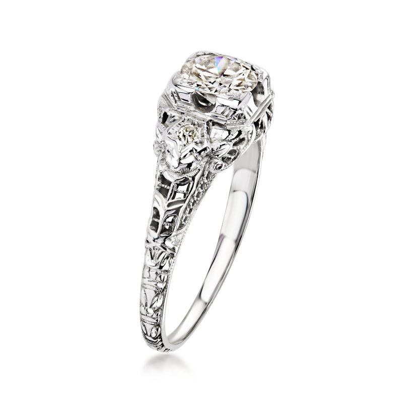 White gold diamond filigree ring with prong-set cushion-cut center stone