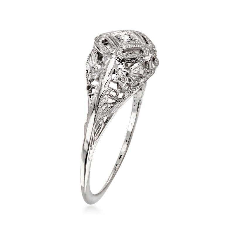 Vintage 10K white gold filigree ring with raised single diamond, side view