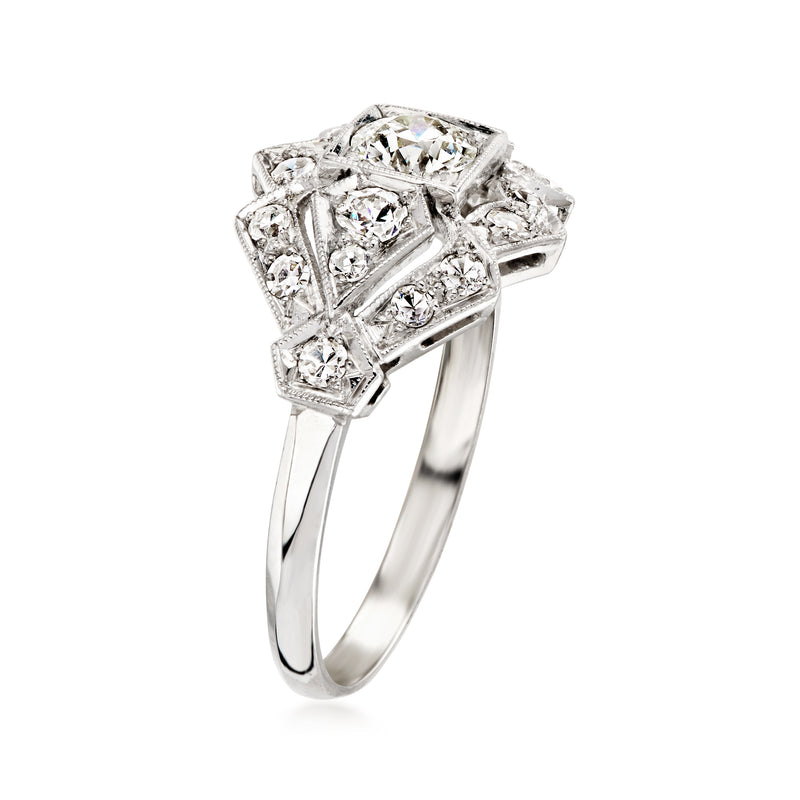 Platinum vintage diamond ring, angled view with square setting and side round accents