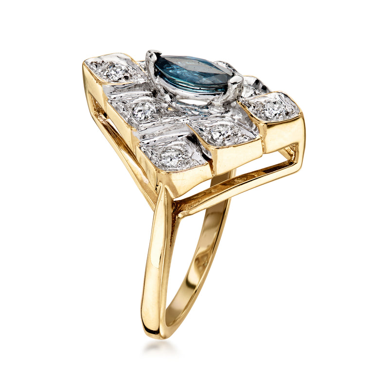 Two-tone gold ring with blue marquise sapphire and diamond accents, side view