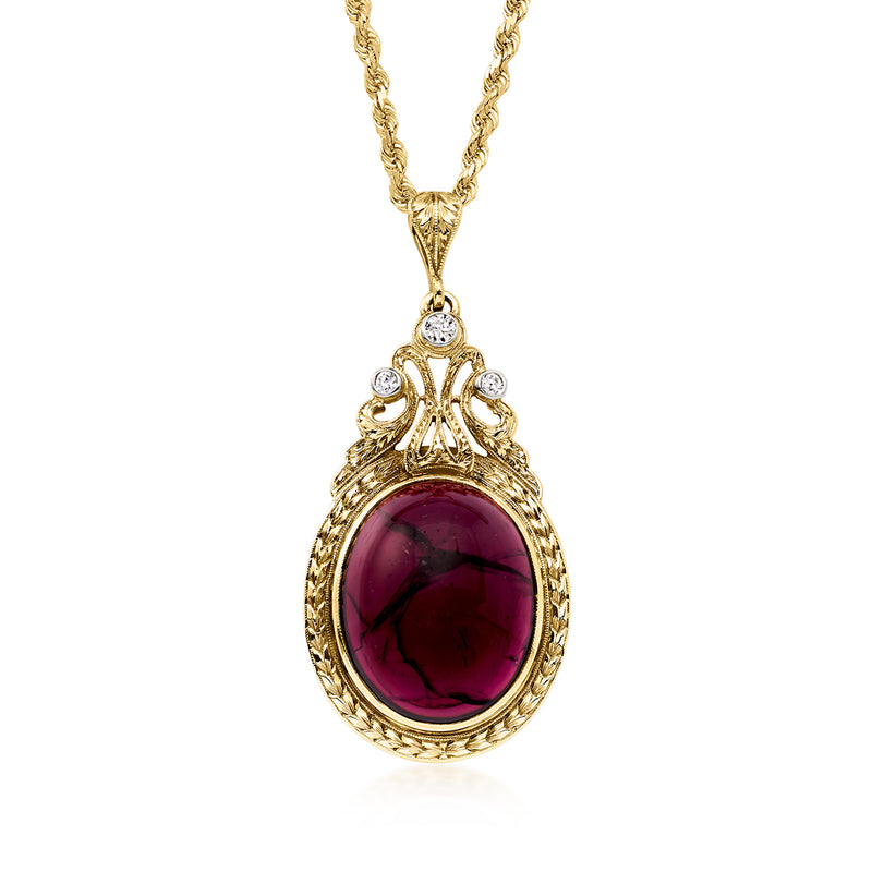 18kt yellow gold vintage pendant necklace with oval garnet cabochon and diamond accents