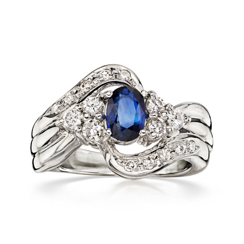 C. 1990 Vintage .63 Carat Sapphire Swirl Ring with .37 ct. t.w. Diamonds in Platinum. Size 5