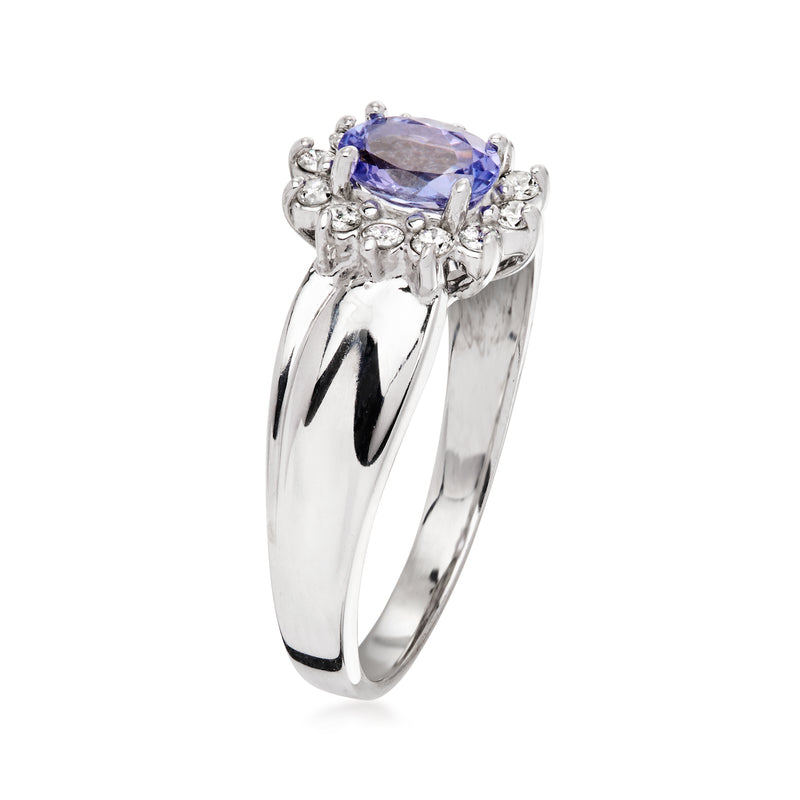 14kt white gold tanzanite ring with oval purple center stone and diamond cluster prongs