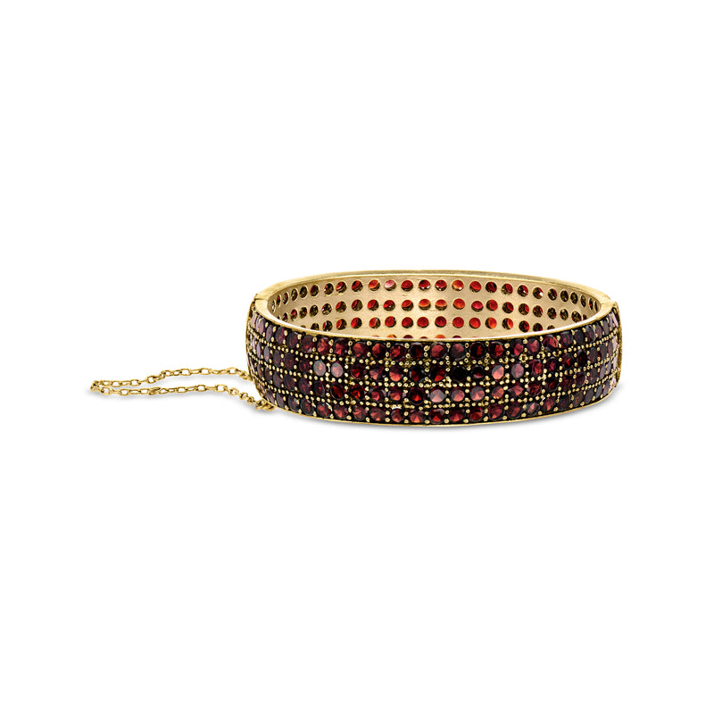 Gold vermeil garnet bangle with dark frame and rows of red stones