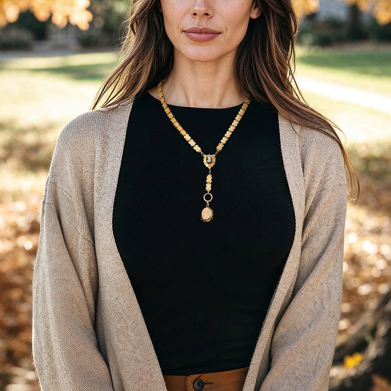 Gold-filled cameo locket drop necklace worn by model, gold chain with small pendant