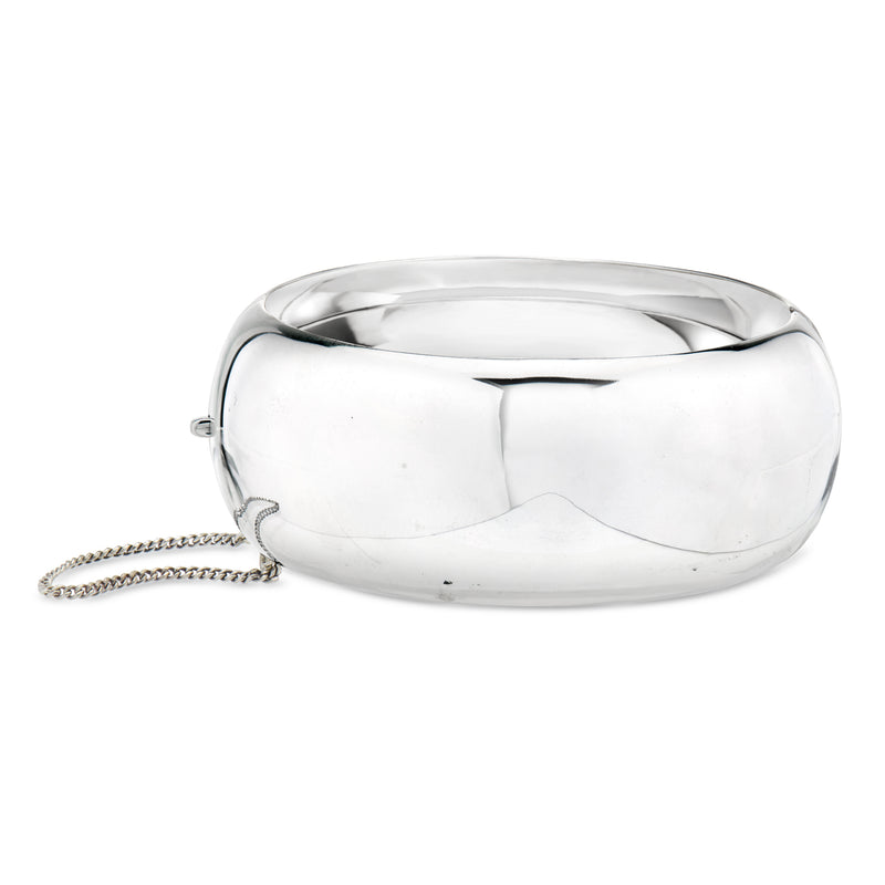 Sterling silver wide hinged bangle bracelet, high-polish finish with small dangling chain
