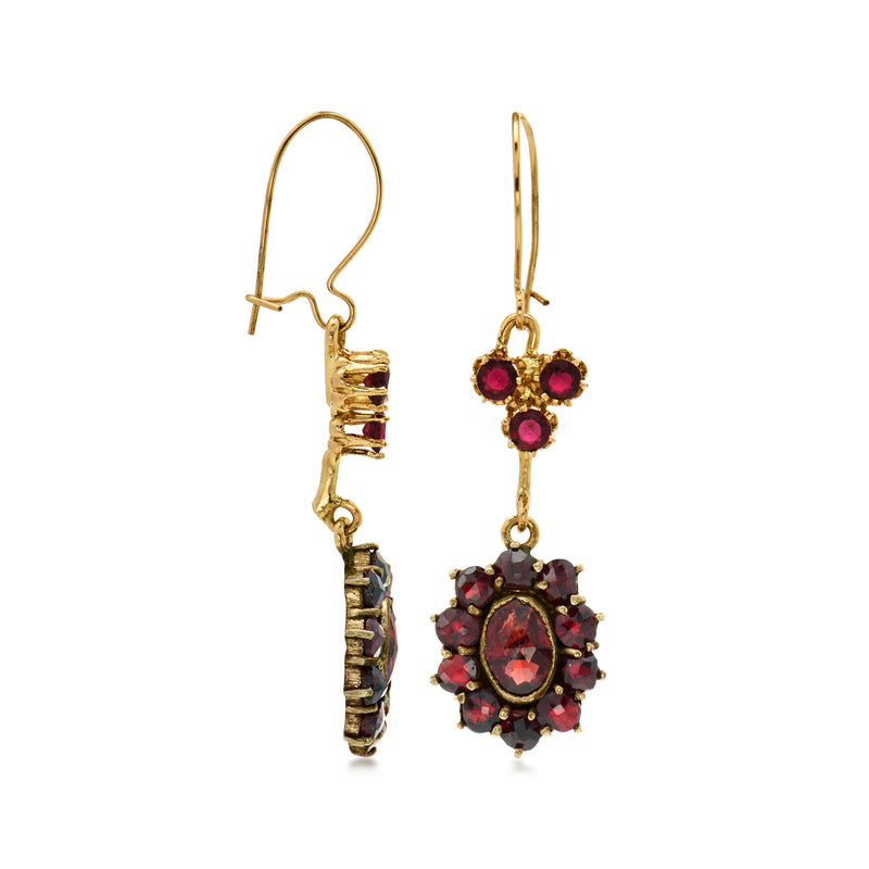 Gold-tone earwire drop earrings with ruby-red cross top and round cluster drops