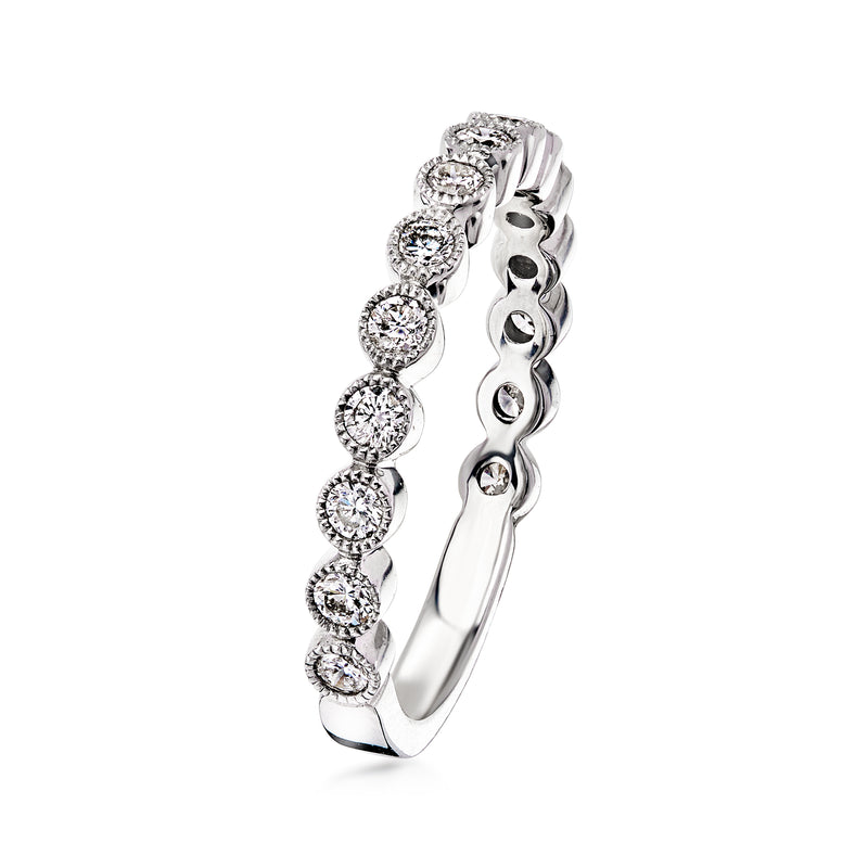 White gold diamond ring side view with round stones set along the curved band