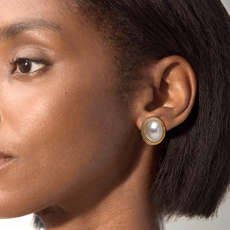 Mabe pearl stud earrings with gold rope bezel on model ear