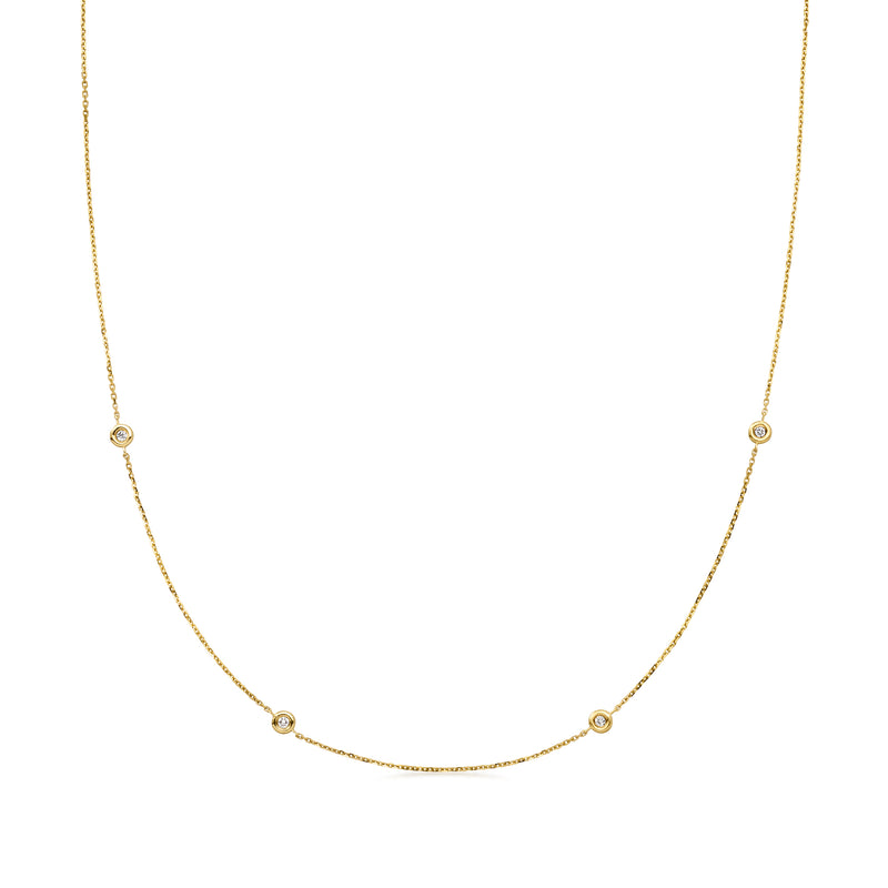 14kt yellow gold diamond station necklace with round diamonds on curved stations