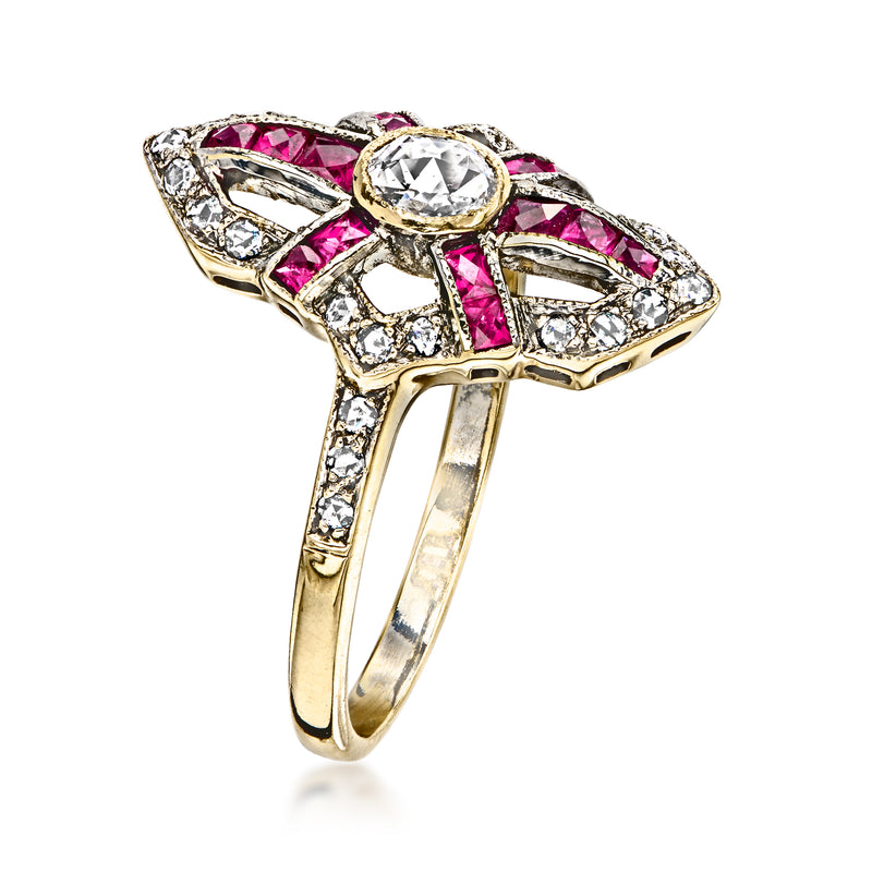 18kt yellow gold ring with center diamond and pink ruby accents in openwork setting