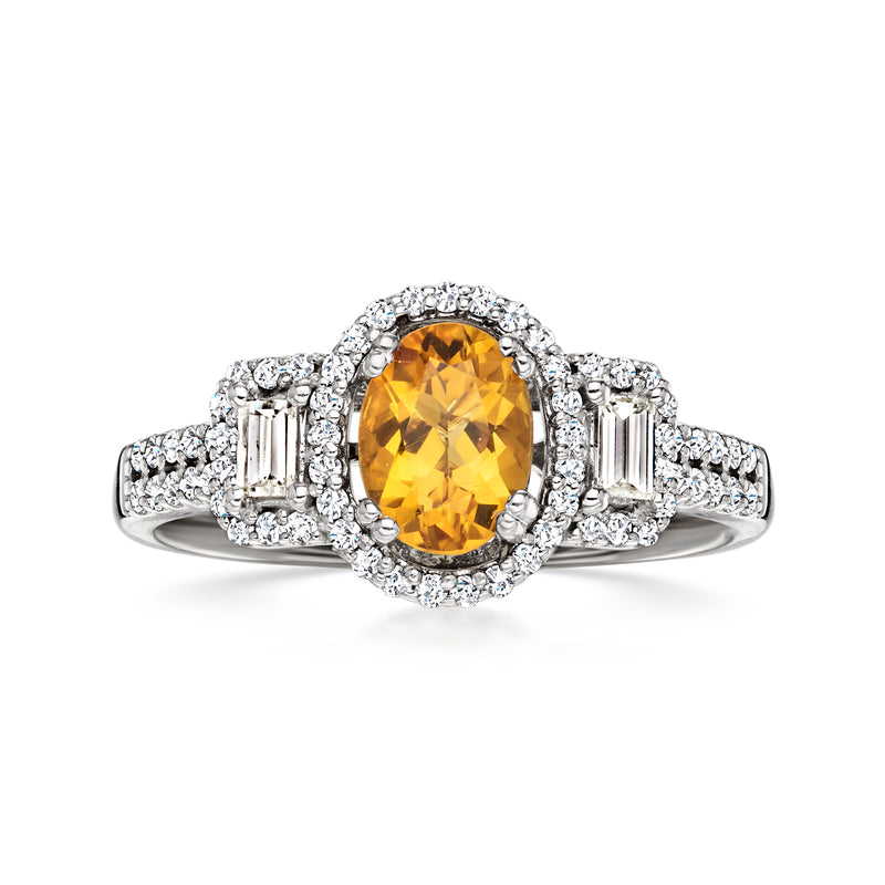 Oval citrine center ring with white gold halo and baguette diamond side stones