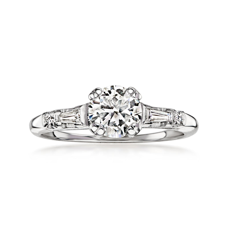 Vintage white gold diamond ring with round center stone and baguette side stones