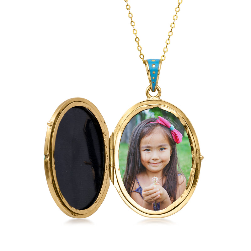 Open oval locket necklace showing photo insert in gold frame
