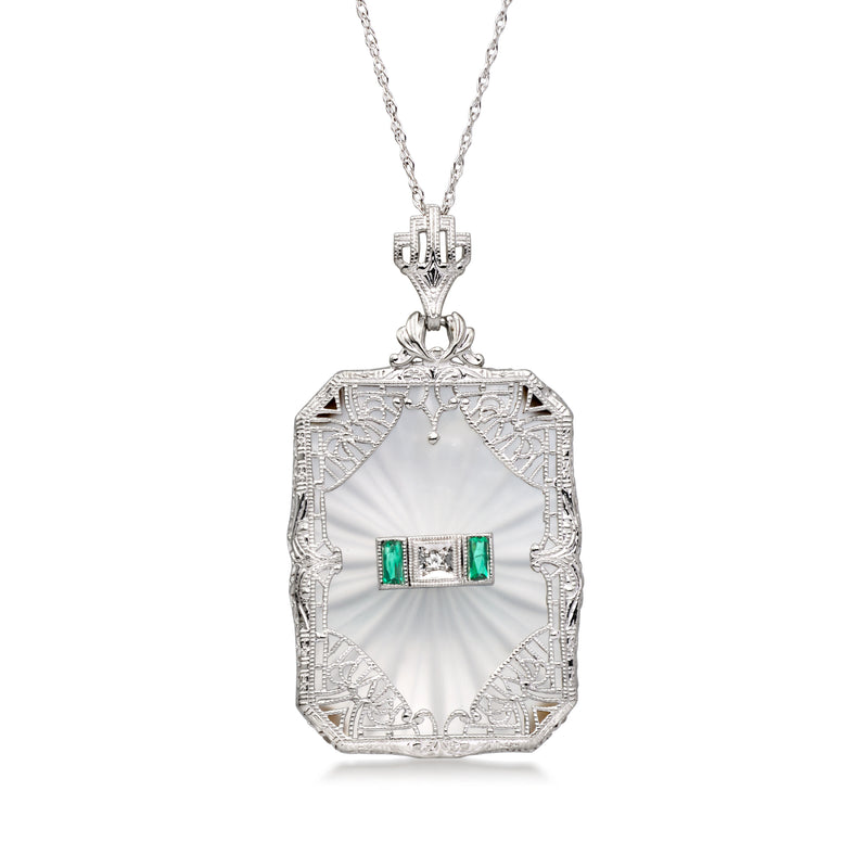 Vintage white gold pendant necklace with ornate frame and green gemstone centerpiece