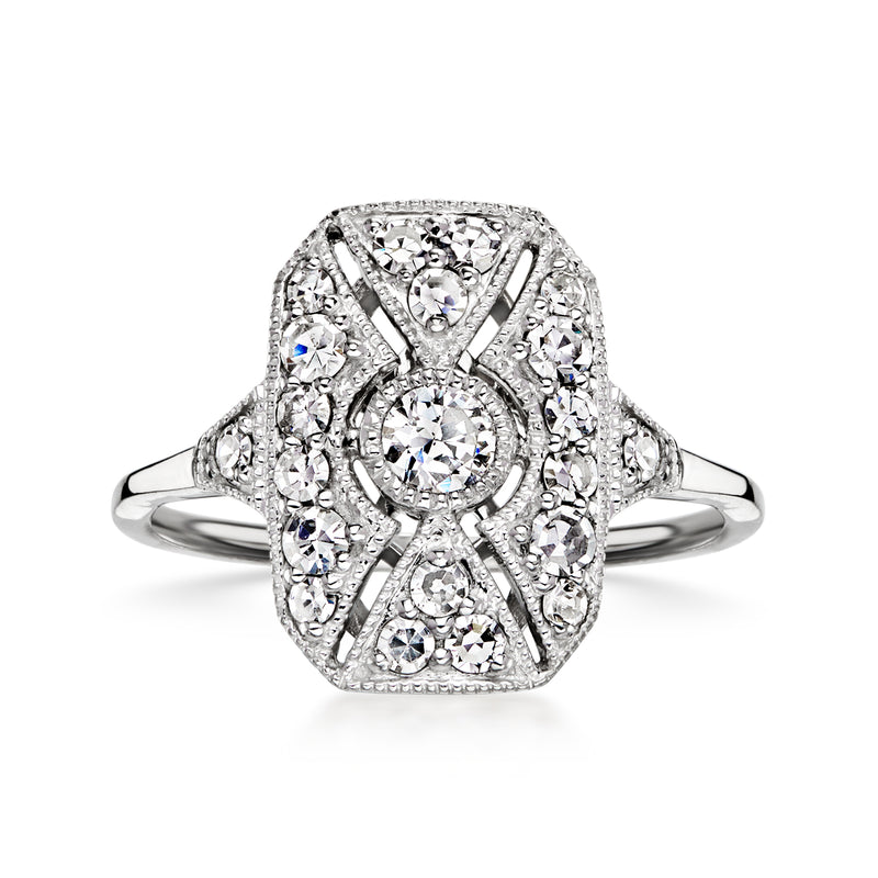 Vintage platinum diamond filigree ring with oval center stone and halo accents