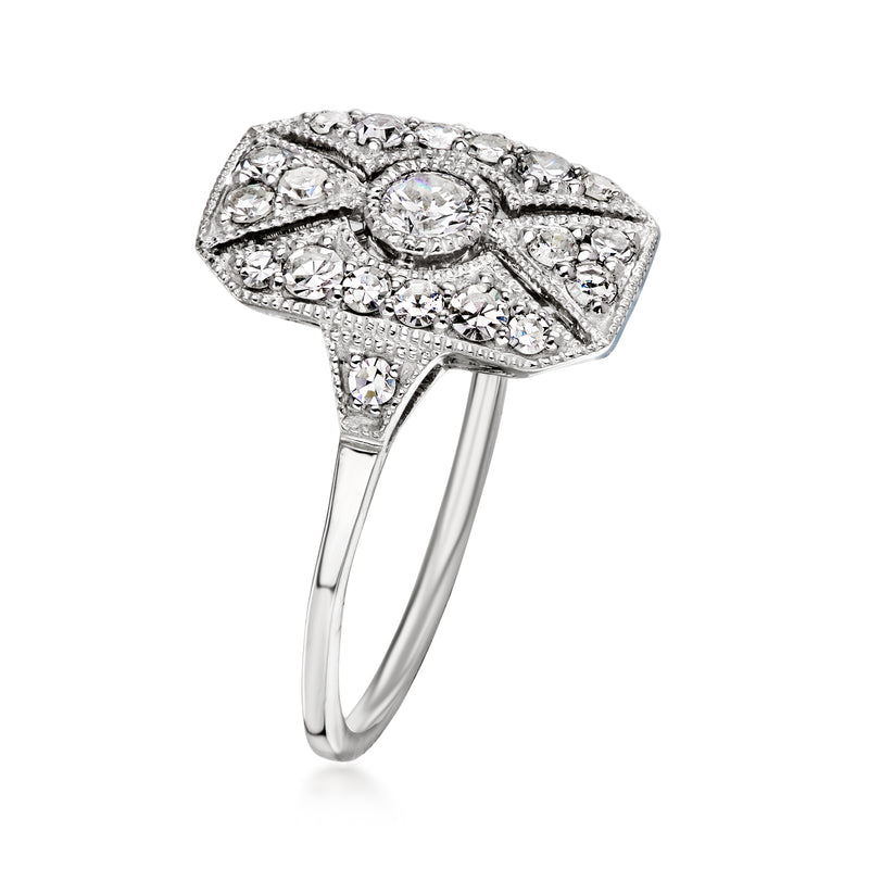 Platinum vintage diamond filigree ring with oval center and side pave accents