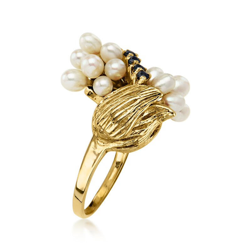C. 1960 Vintage Cultured Oval Pearl and .12 ct. t.w. Sapphire Flower Bypass Ring in 14kt Yellow Gold. Size 7