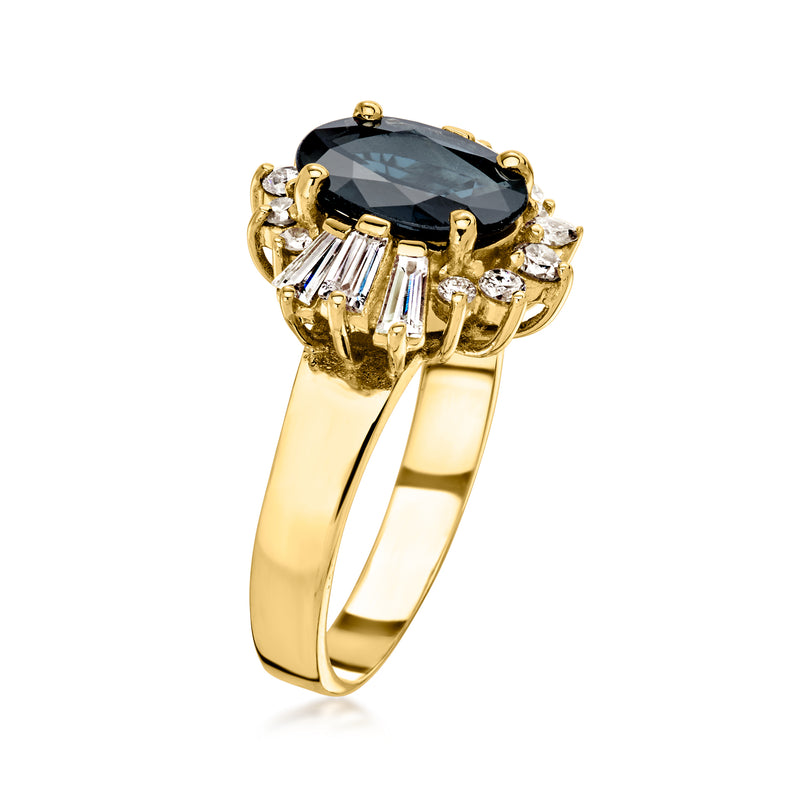 Yellow gold ring featuring oval dark sapphire with baguette and round diamond accents
