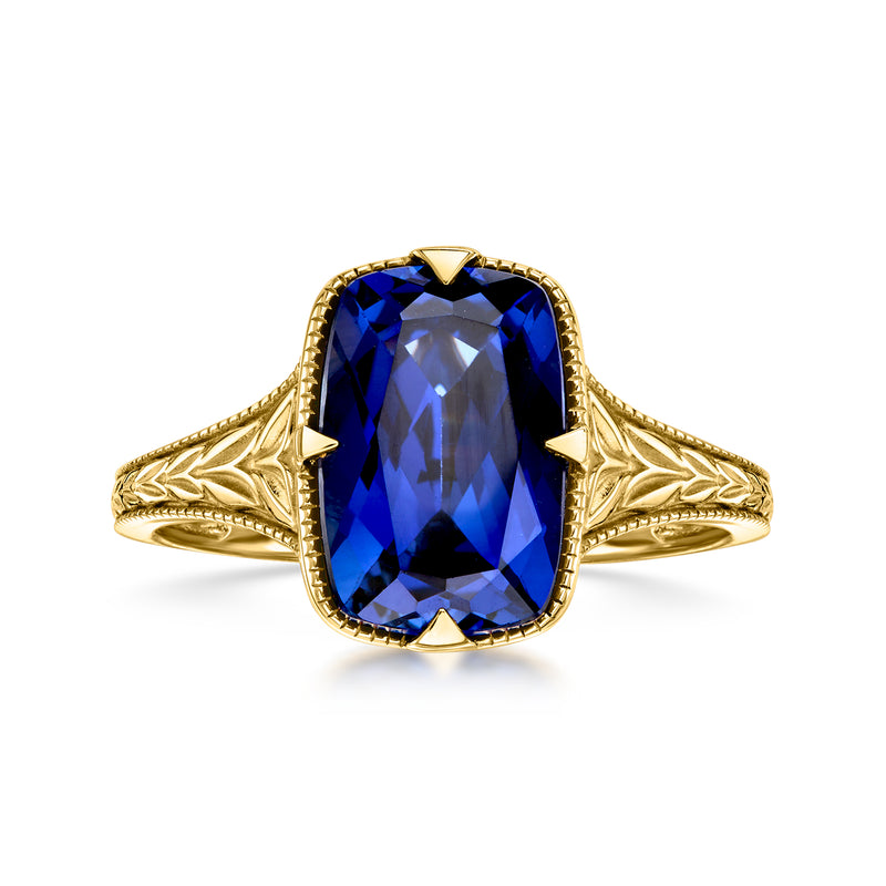 10kt yellow gold sapphire ring with large oval blue lab-grown stone