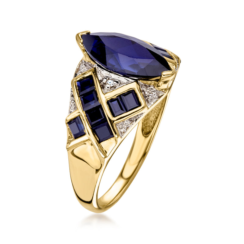 10kt yellow gold vintage ring with large oval blue center stone and sapphire side panels